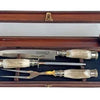 Carving set with deer handle and double nickel silver and steel ferrule in a wooden box with a glass lid